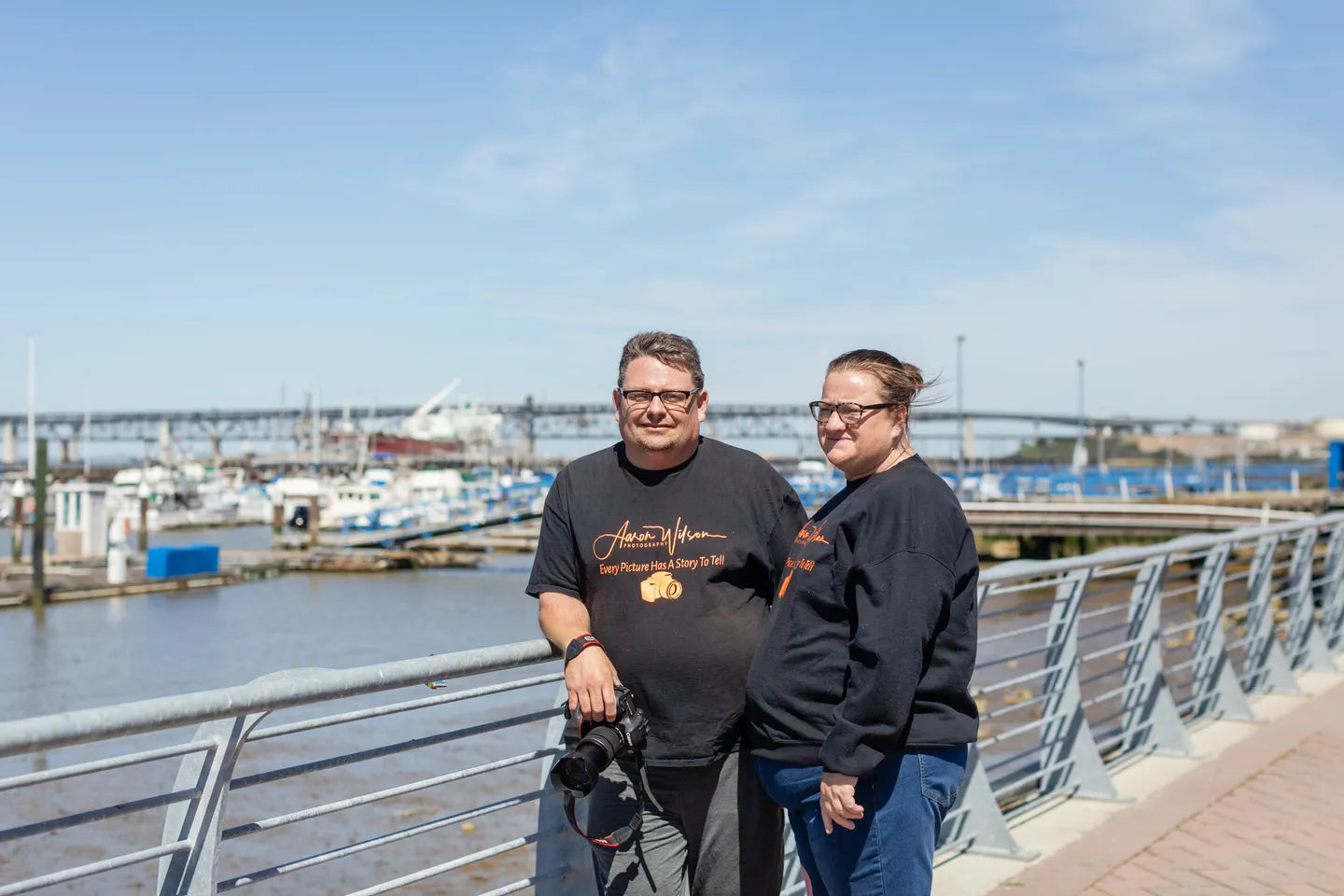 Aaron And Vicky wilson in photography shirts by the water, Wilson and Wick™.